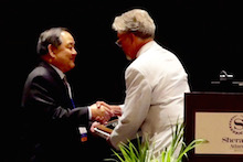 Kent Kobayashi receiving award